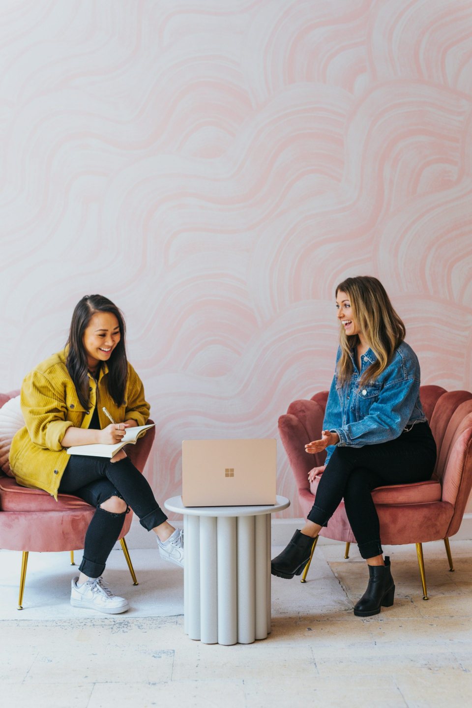 Two women chatting in room